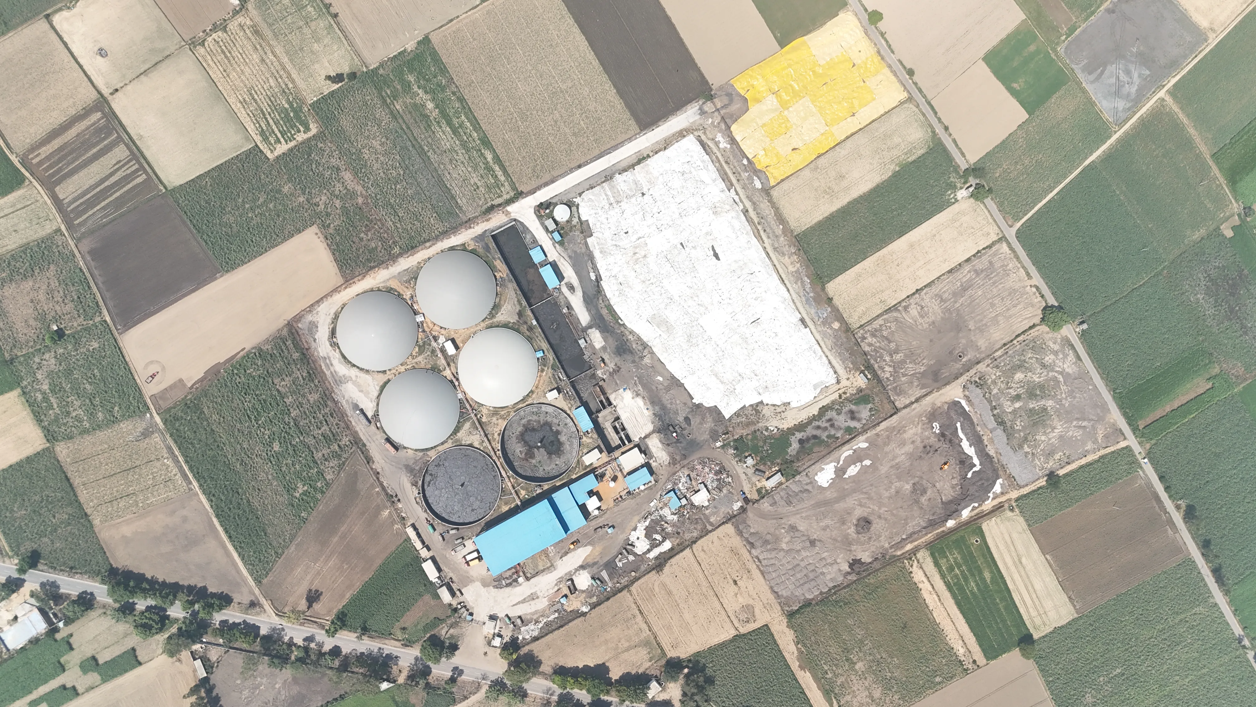 Top-down aerial view of the Circle CBG Meerut plant set within surrounding farm plots