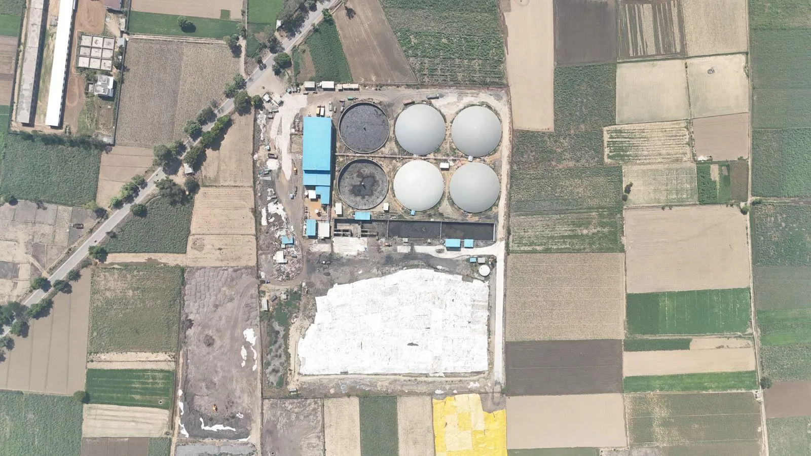 Aerial view of the Circle CBG plant among farmland in Bahadurpur, Tehsil Mawana