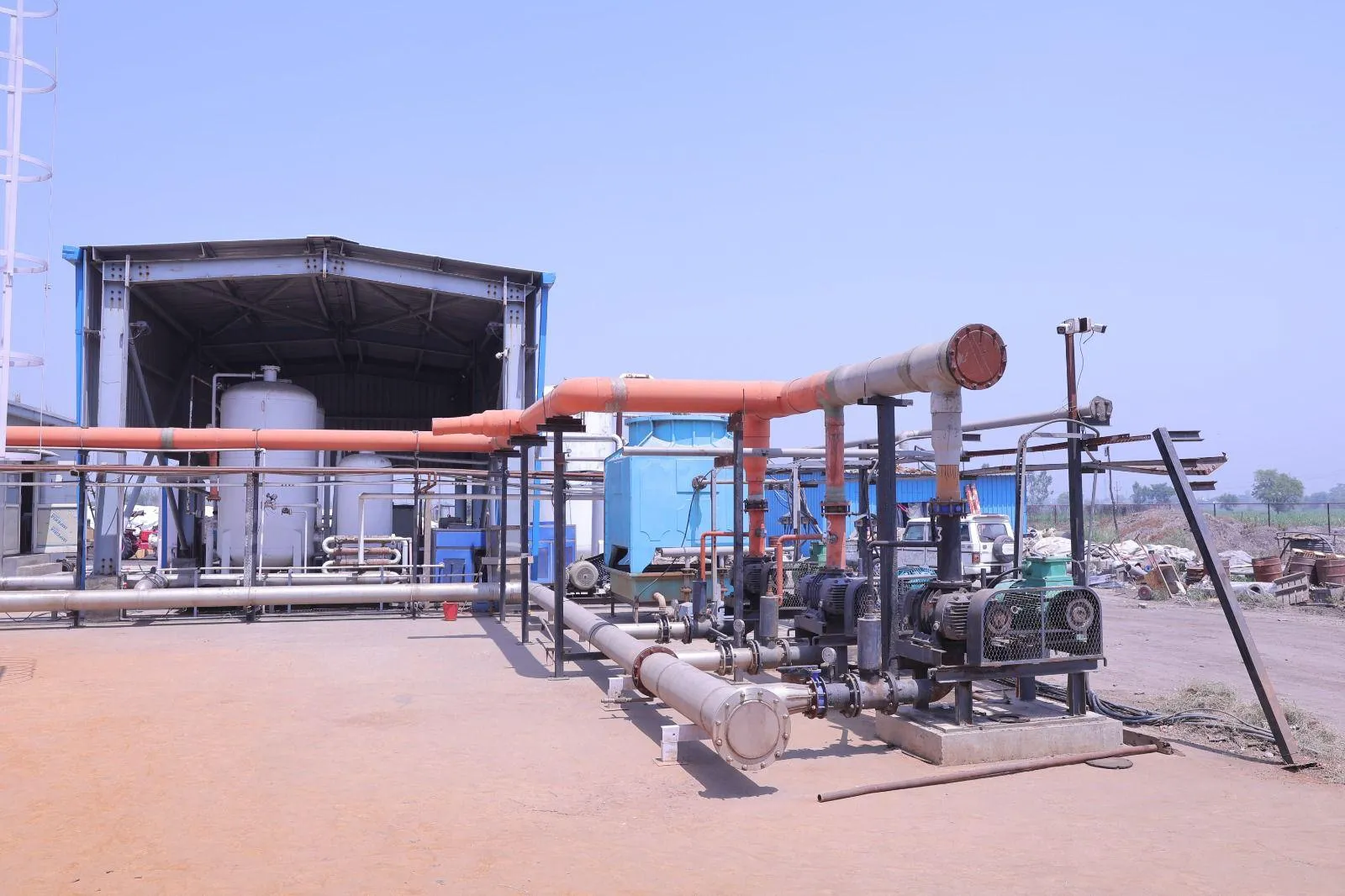 Biogas blowers and gas-cleaning pipework on the process pad at the Meerut plant